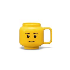 a yellow mug with a smiley face on it