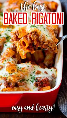 a red casserole dish with lasagna sauce and meat in it, the title says the best baked rigatoni easy and delicious