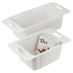 two white plastic containers with magazine holders inside one is open and the other is closed