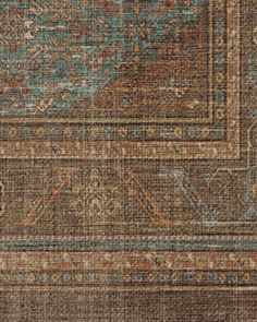 an area rug with many different colors and patterns on it, including brown, blue, orange