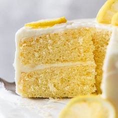 a slice of lemon cake on a plate with a fork