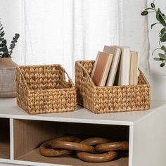 two wicker baskets with books on the shelf