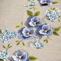 some blue flowers on a beige background