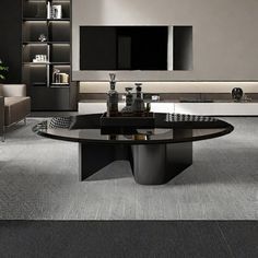 a modern living room with grey carpeting and black furniture