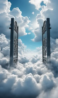 an open gate in the middle of some clouds