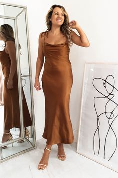 Approx length: 110cm Cowl neckline True to size Silky Stretchy fabric  100% Polyester Colour: Rust Care: Hand was only - Iron inside out on low heat Model is wearing size 8 Model is 5'3 height Copper Bridesmaid Dresses, Brown Satin Dress, Brown Silk Dress, Mocha Dress, Oh Hello Clothing, Brown Bridesmaid Dresses, Rust Bridesmaid Dress, Silk Bridesmaid Dresses, Maid Of Honour Dresses