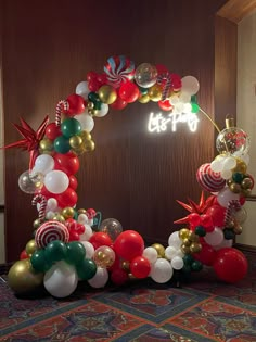 an arch made out of balloons and candy canes