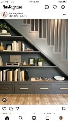 an image of a book shelf under the stairs