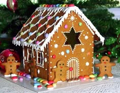 a gingerbread house decorated with icing and candy