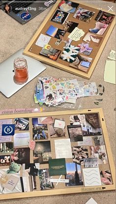 there are many pictures on the table and one has a pin board with magnets attached to it