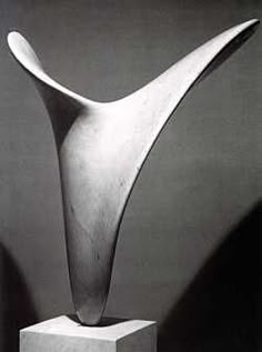 a black and white photo of an abstract sculpture