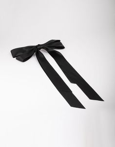 Bows are having their moment! Style the popular coquette trend with our selection of silky hair bows in a range of different colours. This black, oversized hair ribbon features an aligator clip at the back, perfect for styling in a half-up hairstyle. Dimensions: Length 460mm x Width 215mm Weight: 35g | Lovisa Black Fabric Oversized Ribbon Hair Bow Clip Hair Bow Clip, Bow Clip, Hair Ribbon, Ribbon Hair Bows, Ribbon Hair, Jewellery Accessories, Half Up Hair, Silky Hair, Bow Hair Clips