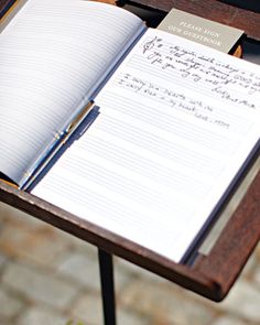 an open notebook sitting on top of a wooden table