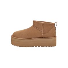 A modern interpretation of Ugg's icon, the Ultra Mini reaches new heights with a leg-lengthening 2" platform. Offering a bolder look than ever, it's made with the same rich suede as the original, plus our UGGplush™ wool blend for signature softness. The outsole of this product is either a SugarSole™ outsole, which is a responsible compound using sugarcane foam that allows us to reduce dependency on fossil fuels by replacing petroleum-based ethylene, or a Treadlite by UGG™ outsole. Suede upper Ov Brown Platform Boots For Streetwear, Ugg Classic Ultra Mini, Fossil Fuels, Snow Boots Women, Ugg Classic, Platform Ankle Boots, Classic Boots, Platform Boots, Casual Look