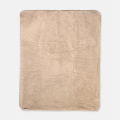 a beige rug on a white background with no one in it or someone out there