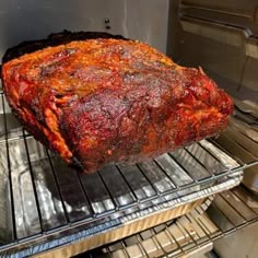 a large piece of meat sitting on top of an oven