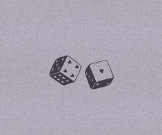 two dices that are sitting on top of each other in the middle of a gray background