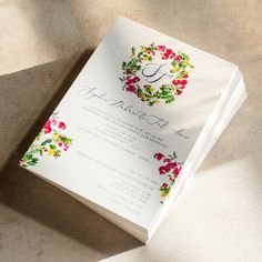 a wedding card with flowers on it and the letter g is for floral wreaths