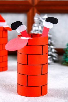 two paper cups made to look like santa's chimneys