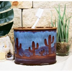 This Southwestern Desert Cactus Design Bathroom Accessory Piece measures 4.25" High, 5.25" Wide and 2.5"Deep approximately. It weighs about 10 ounces.  This Southwestern Desert Cactus Design Bathroom Accessory Piece is made of fine designer polyresin, hand crafted and painted individually.  Western decor is all about spunk and spirit, bringing together the desert beauty of the southwest with rugged cowboy charm and rustic good looks.  With the theme of Arizona's Beautiful Desert Wilderness, this Cactus Bathroom Decor, Cactus Bathroom, Rugged Cowboy, Cactus Arizona, Desert Beauty, Toothbrush And Toothpaste Holder, Beautiful Desert, Bathroom Accents, Southwestern Home