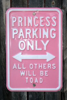 a pink sign that says princess parking only all others will be toaded on it