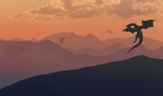 a silhouette of a dragon flying over mountains