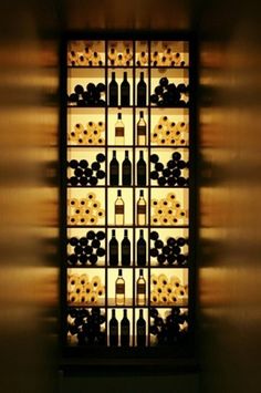 a wine rack filled with lots of bottles