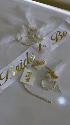 the bridal sash and bracelets are on display