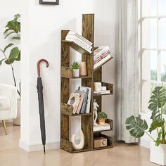 a book shelf with books and an umbrella