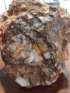 a large rock sitting on top of a wooden table