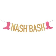 a pink and gold hash bash banner hanging from a string with boots on it's side