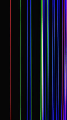 an image of multicolored lines in the dark