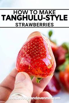 a person holding a strawberry in their hand with the words how to make tanguli - style strawberries