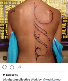 the back of a woman's body with arabic writing on it