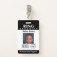 an id badge is attached to a white wall