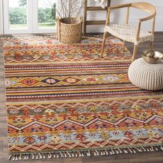 an area rug with various colors and patterns