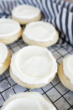 cookies with white frosting on a cooling rack