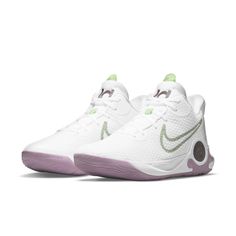 the nike zoom basketball shoe in white and purple