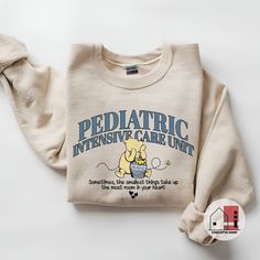 a sweater with the words pediatric intensive care unit printed on it