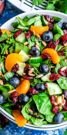 White bowl with colorful spring mix salad with orange segments, blueberries, cranberries, cucumber, and more! Blueberry Balsamic Dressing, Balsamic Salad Dressing, Blueberry Balsamic, Salad Recipes Healthy, Spring Recipes Dinner, Dressing Salad, Spring Mix Salad, Vegetarian Salad Recipes