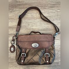 Fossil Metallic Bronze Brown Leather Satchel Crossbody Shoulder Bag With Flap Top Adjustable Strap Can Be Worn Crossbody Or As Shown. Lots Of Pockets Non-Smoking Household Excellent Condition Very Gently Used Brown Leather Satchel, Fossil Bags, Brown Silver, Leather Satchel, Crossbody Shoulder Bag, Fossil, Adjustable Straps, Brown Leather, Satchel