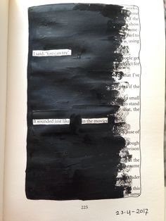 an open book with black ink on it