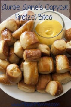 a white plate topped with pretzel bites covered in butter