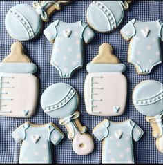 baby shower cookies are arranged on a table