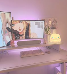 two computer monitors sitting on top of a white desk next to a keyboard and mouse