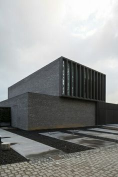 the building is made out of grey bricks