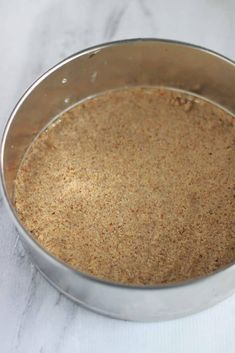 a metal pan filled with food on top of a white counter