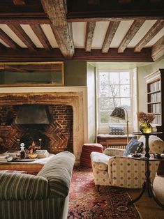 a living room filled with furniture and a fire place