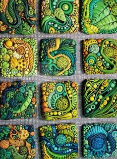 some colorful tiles with different designs on them