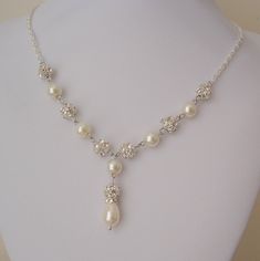 "This Bridal Y Drop Necklace featuring pearls and rhinestones with a Pearl drop necklace will suit most gowns or perfect as your bridesmaid gifts. Necklace:  - Pearl and Rhinestones measures 8mm each - Length 24\", includes chain extension so that the length can be adjusted, let me know if you require a different necklace length.  It will be delicately packaged for a safe arrival to you." Wedding Necklace Pearl, Bridal Necklace Pearl, Gold Crystal Necklace, Drop Necklaces, Bridal Pearl Necklace, Pearl Drop Necklace, Wedding Necklaces, Bridesmaid Pearls, Pearl Bridal Jewelry